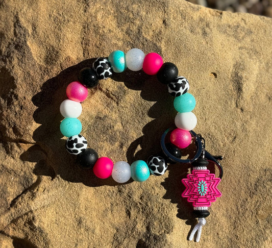 Pink Aztec cow wristlet